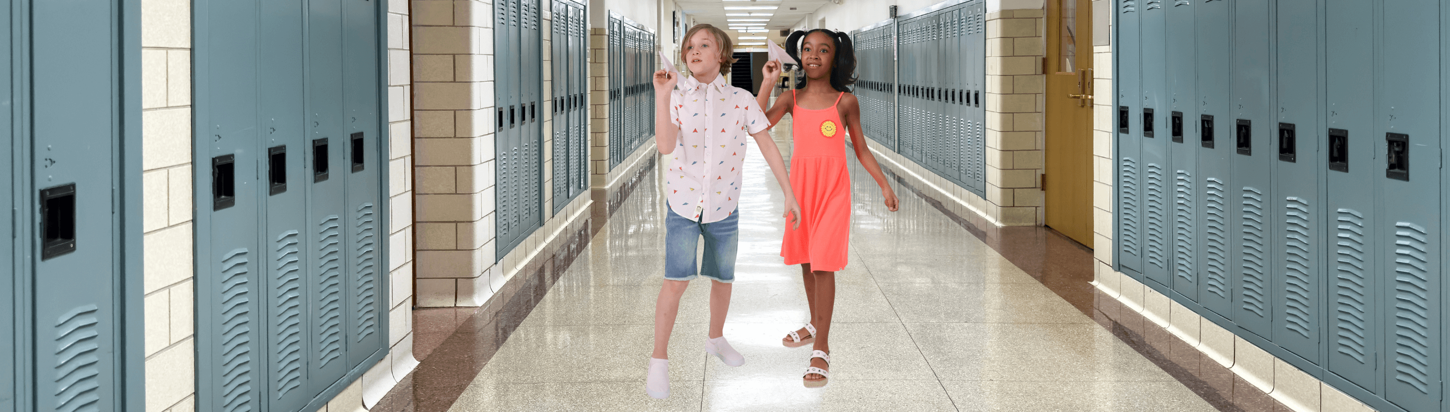 Two stylish kids celebrating the last day of school in a vibrant hallway with lockers, showcasing joyful fashion.