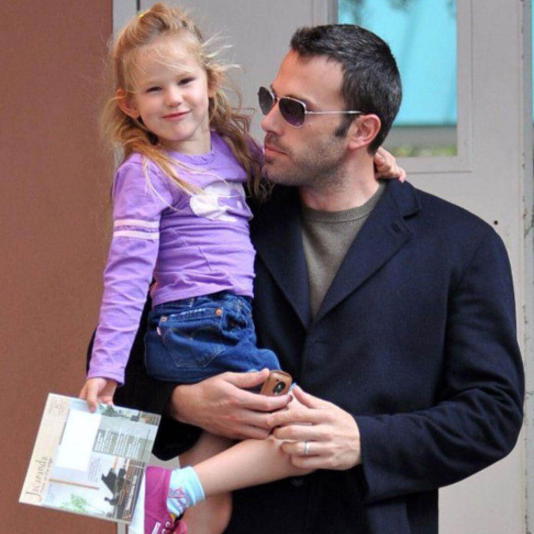 Violet Affleck styles an Appaman tee, flashing a smile with her dad Ben Affleck on a fun outing in Los Angeles.