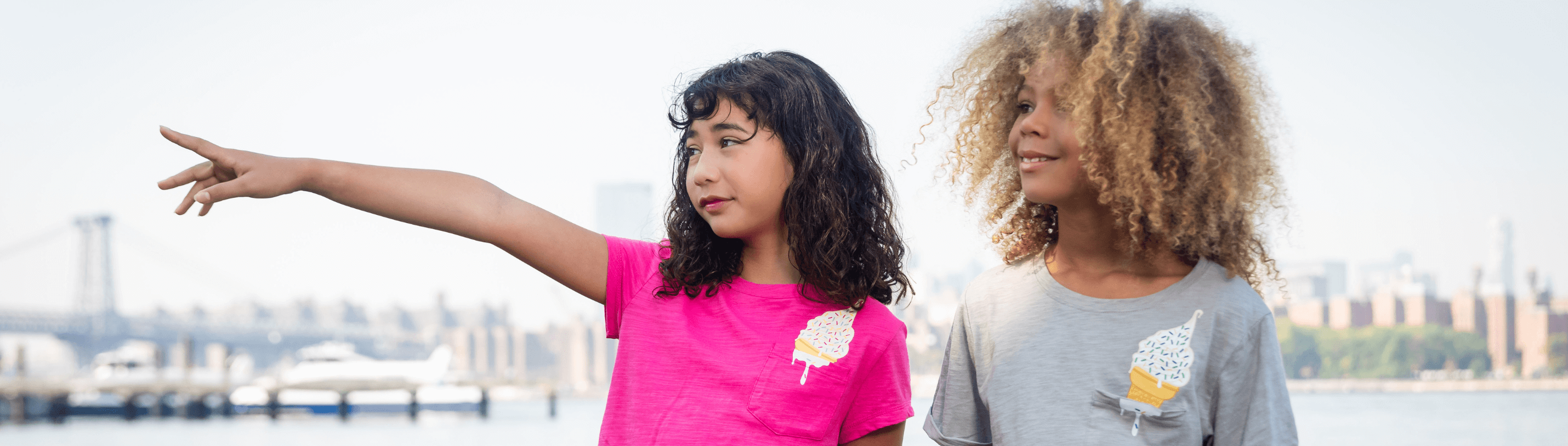 Two kids enjoying summer in stylish ice cream-themed tees, the perfect blend of fun and fashion for trendy children's outfits.