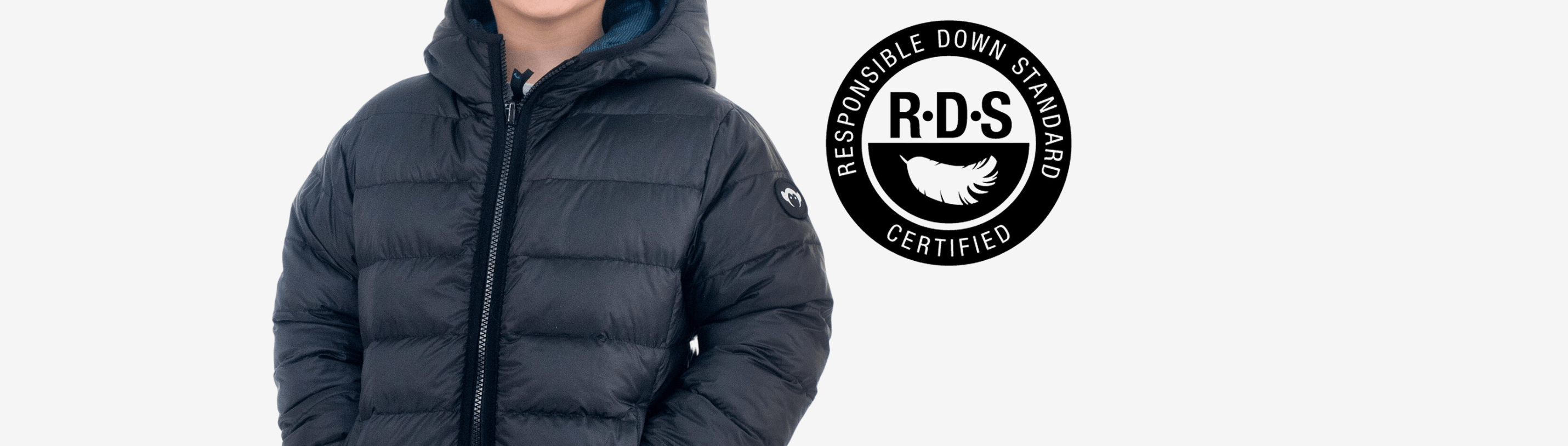 Stylish child wearing an RDS certified down jacket, showcasing Appaman's commitment to responsible fashion.
