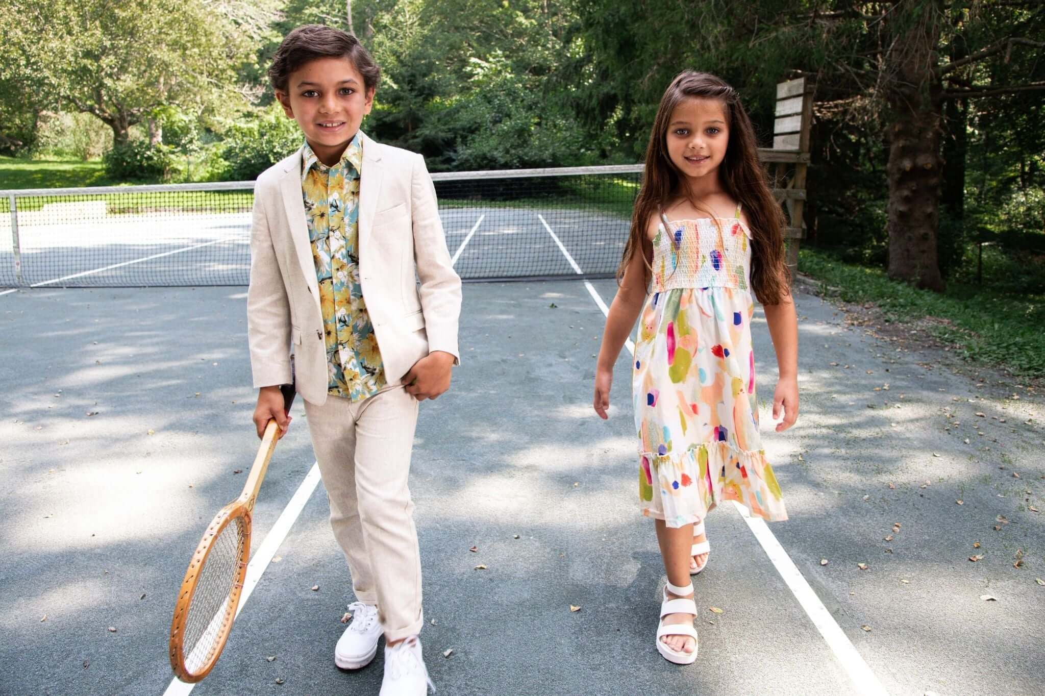 Stylish kids rocking playful outfits for a trendy day at the court, perfect for summer adventures.