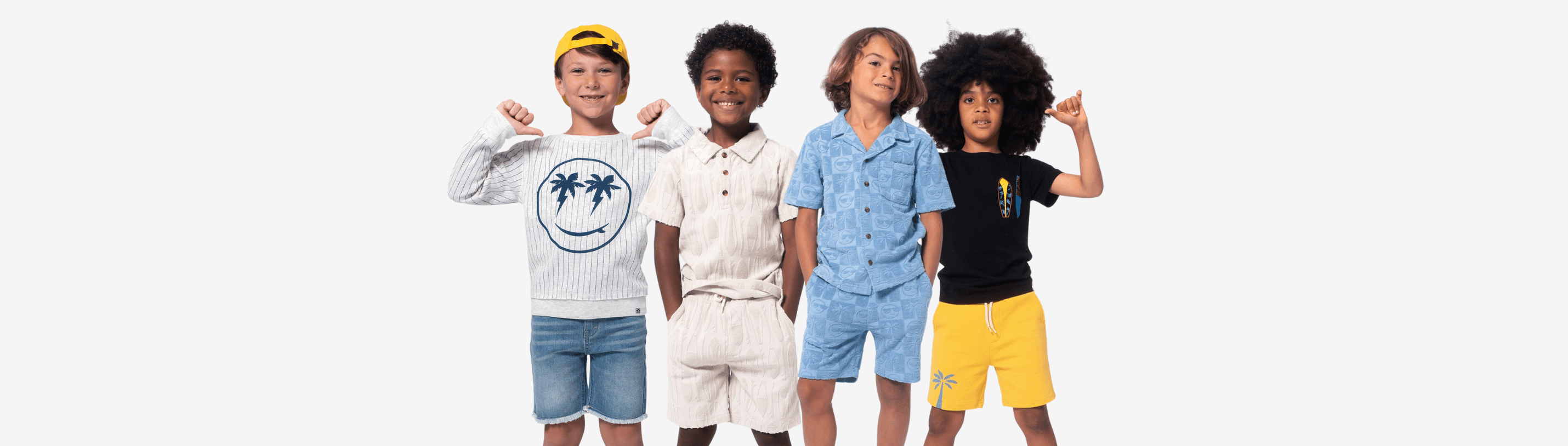 Four stylish boys showcasing trendy summer outfits, radiating confidence and fun in their playful looks.