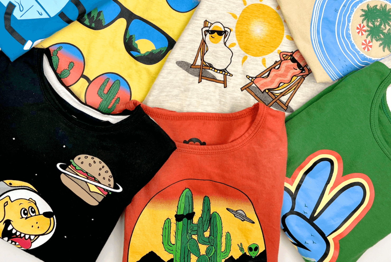 Colorful kids' graphic tees featuring fun designs like burgers, sunglasses, and cacti—perfect for stylish summer adventures!