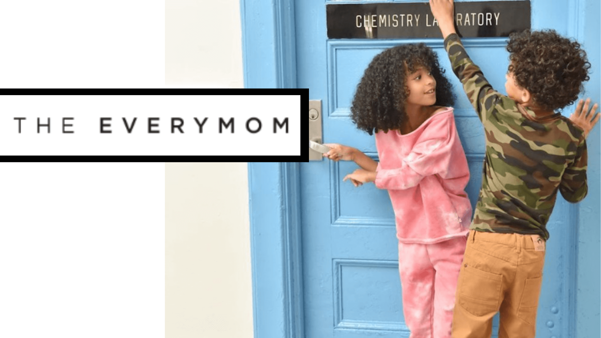 Two kids joyfully playing outside a chemistry lab door, showcasing playful kids' clothing and vibrant styles.