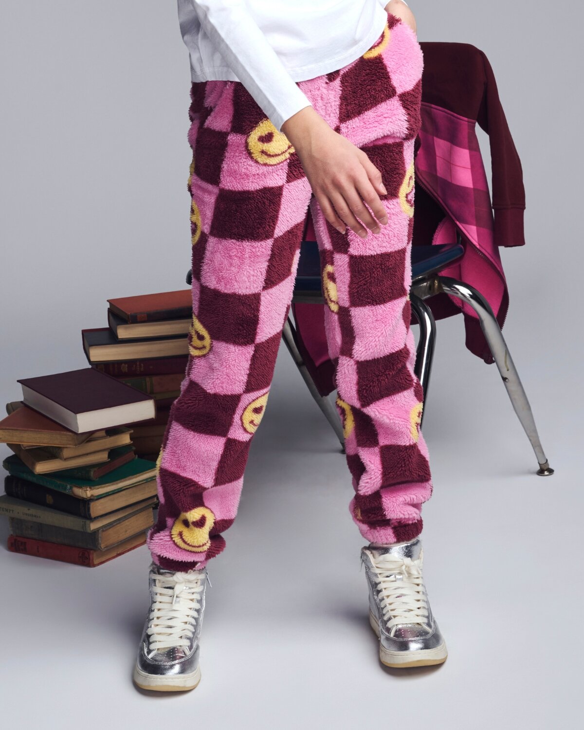 Girls' Sweatpants & Joggers featuring heart prints, stylishly paired with golden shoes in a cozy autumn setting.