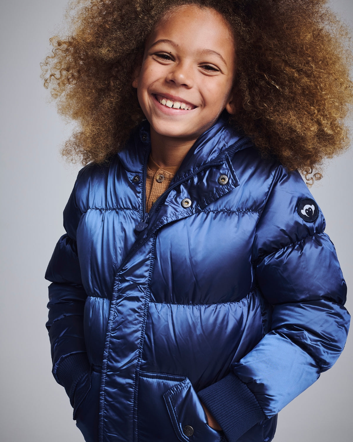 Two kids in stylish puffy coats, perfect for winter adventures—durable, cozy, and oh-so-cute!