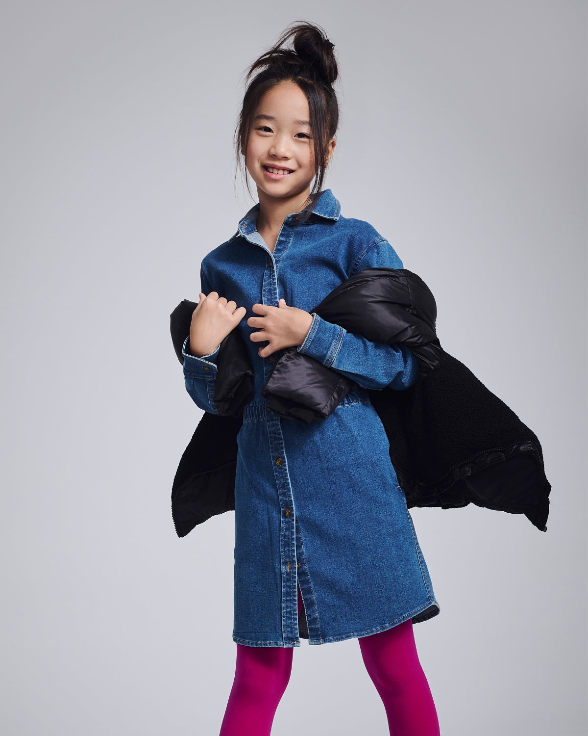 Cheerful girl in a vibrant yellow floral dress, perfect for sunny days and back-to-school adventures!