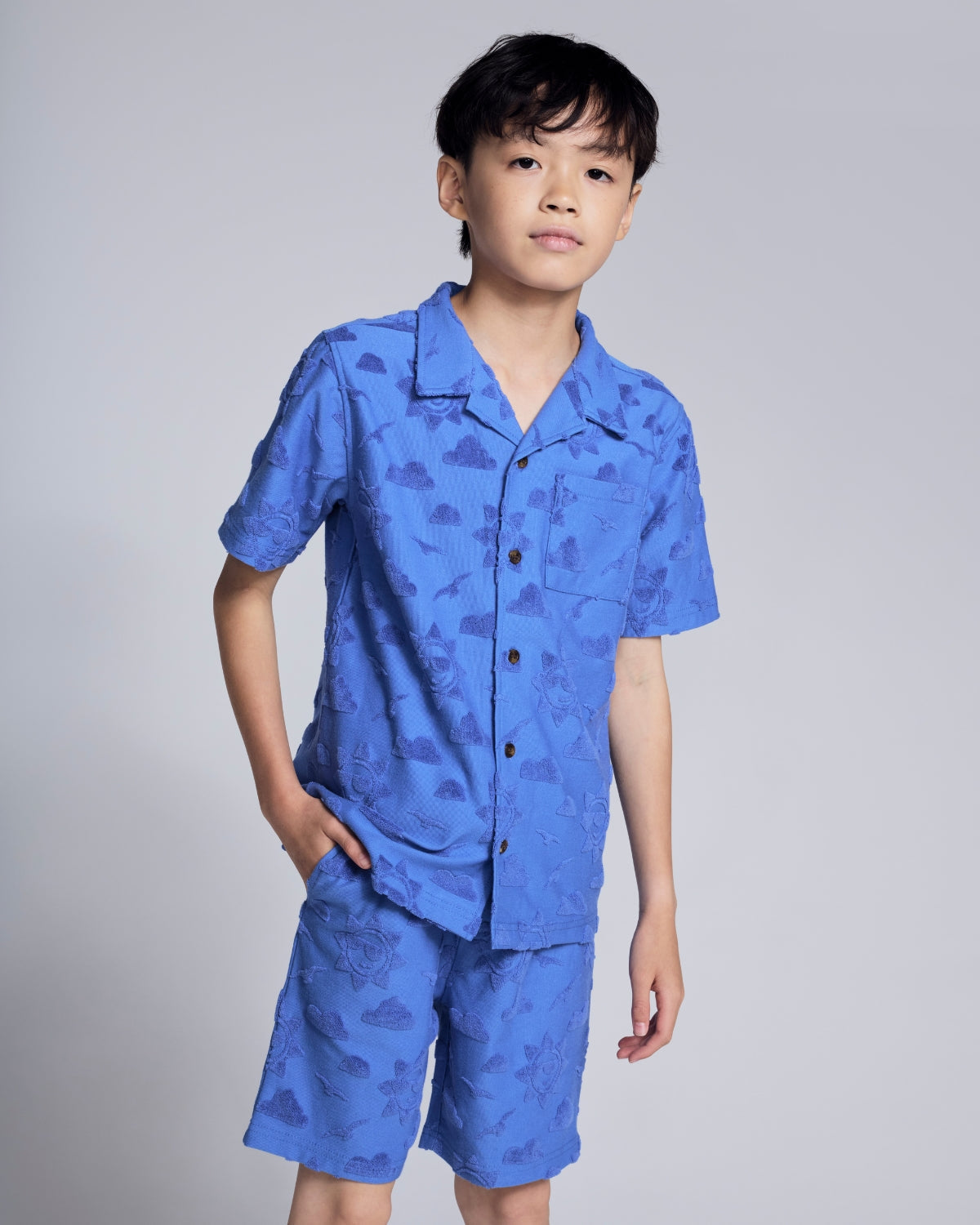 Boys' Swim Cover Ups showcased on two kids in colorful swim shirts and shorts, perfect for beach and pool days.