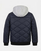 Navy quilted jacket with gray hood on a white background