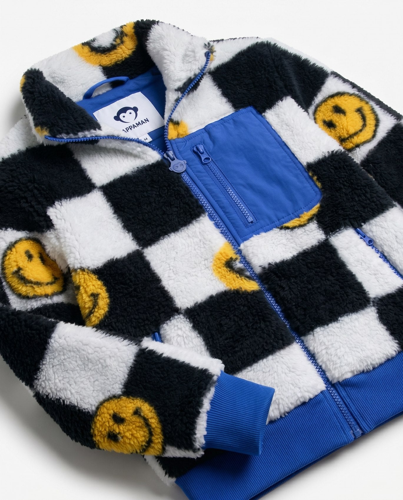 Children's fleece jacket with checkered pattern and smiley face designs on a white background