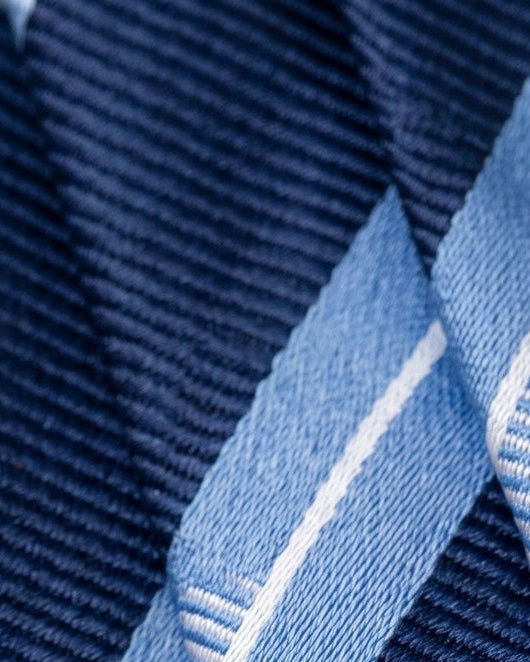 Close-up of a blue fabric with a textured pattern