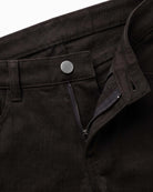 Black Commuter Twill Pants featuring a zip fly, button closure, and durable fabric for versatile styling.