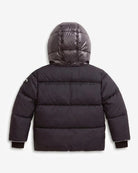 A dark gray hooded puffer jacket shown from the back, featuring horizontal quilting, a shiny finish on the hood, and ribbed cuffs, photographed against a light gray background.
