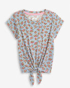 Blue Floral Allison Tie Front Tee featuring playful tie front and soft floral print on a blue background.