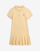 Buttercup Polo Pleated Dress in yellow with short sleeves and pleated skirt, perfect for play and school days.