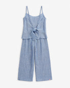 Canopy Stripe Blue Bow Jumpsuit featuring a tie front bow and breathable linen blend for sunny day adventures.