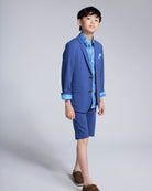 Boy wearing the Canopy Blue Trouser Short with matching jacket, showcasing a polished yet comfortable summer outfit.