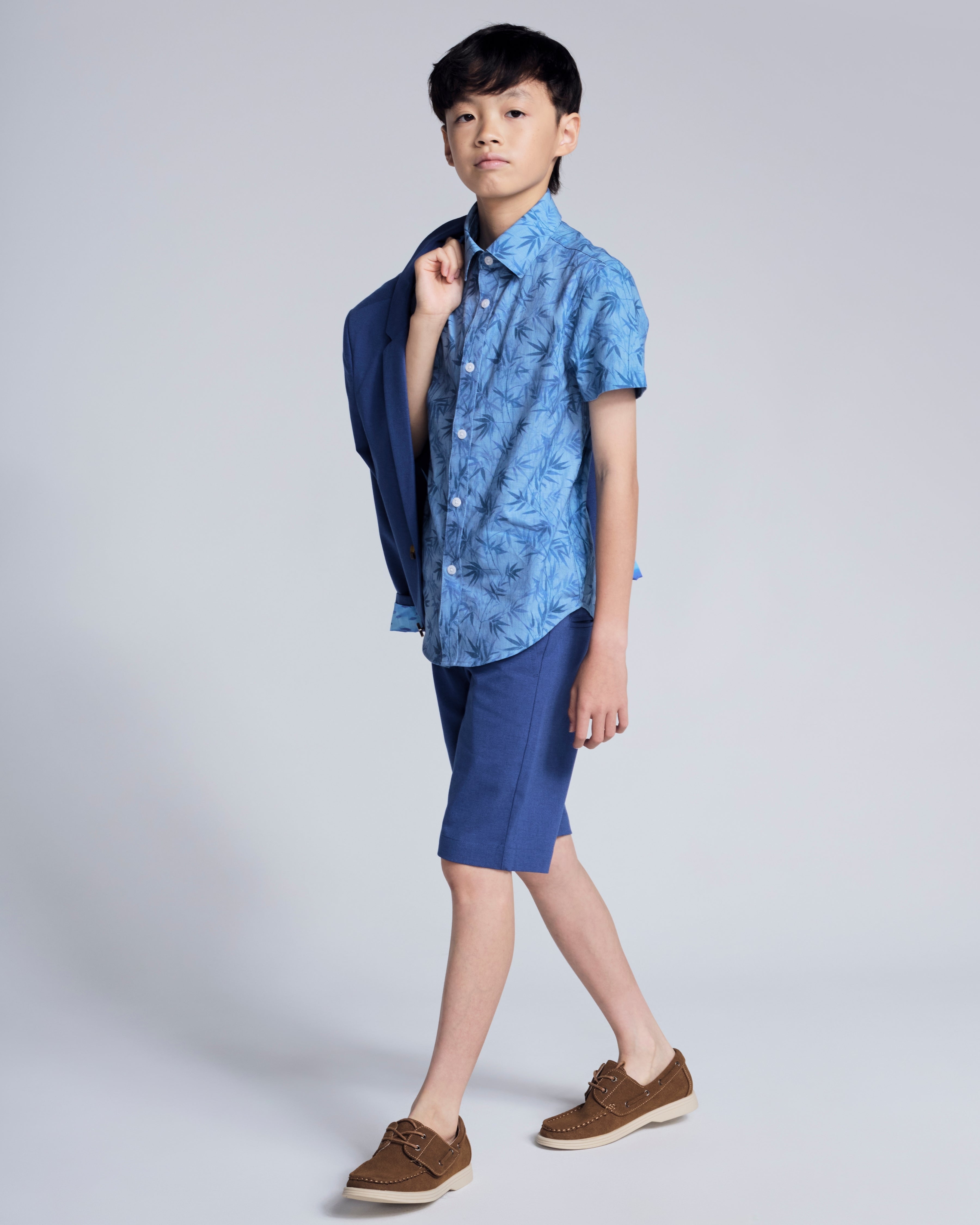 Canopy Blue Trouser Short worn with a blue shirt, showcasing a stylish summer look for kids.