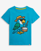 Carnival Parrot Teal Graphic Short Sleeve Tee featuring a playful parrot playing drums.
