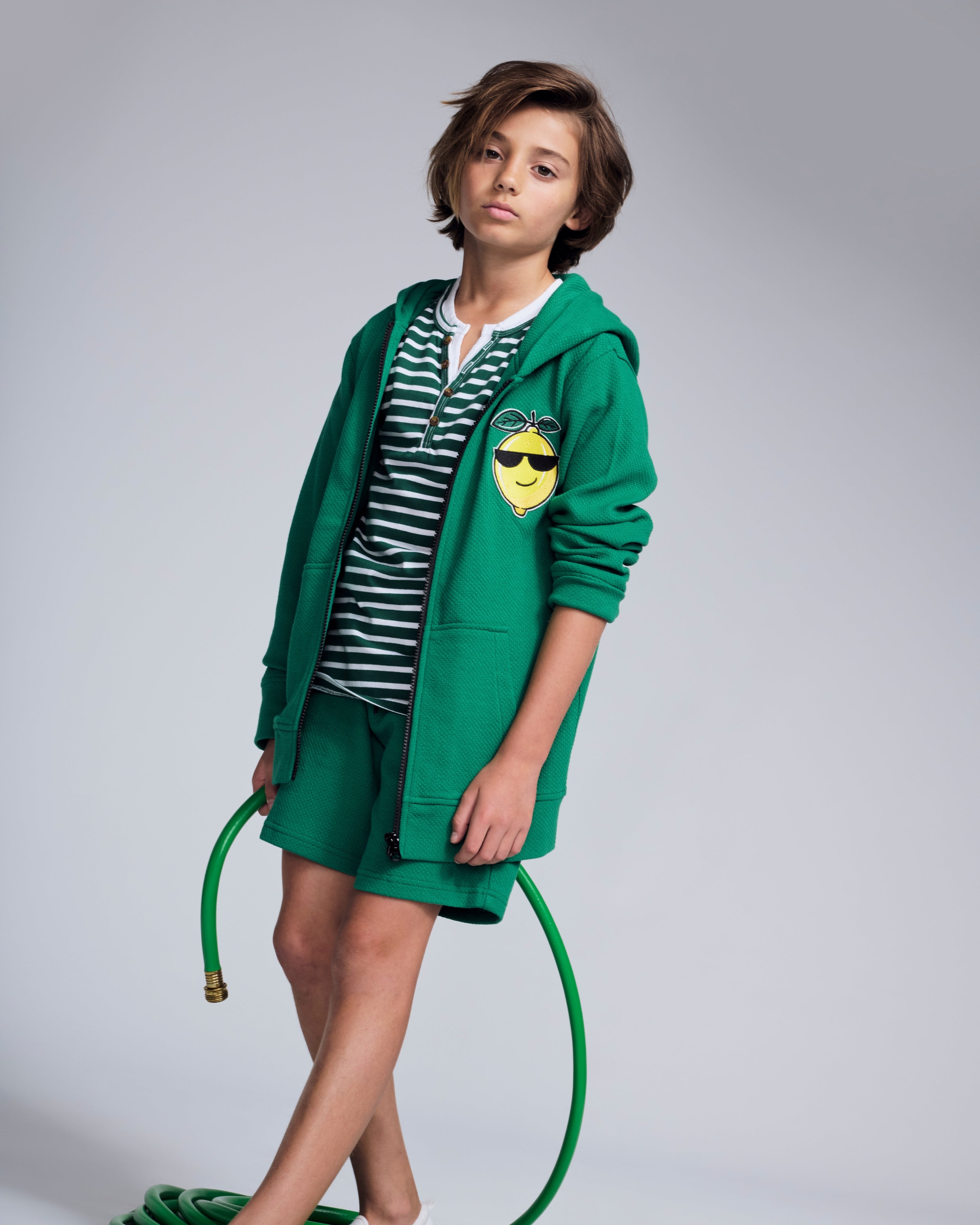 Cool Lemon Strivers Hoodie worn by a child with a green zip-up design and cool lemon graphic patch.