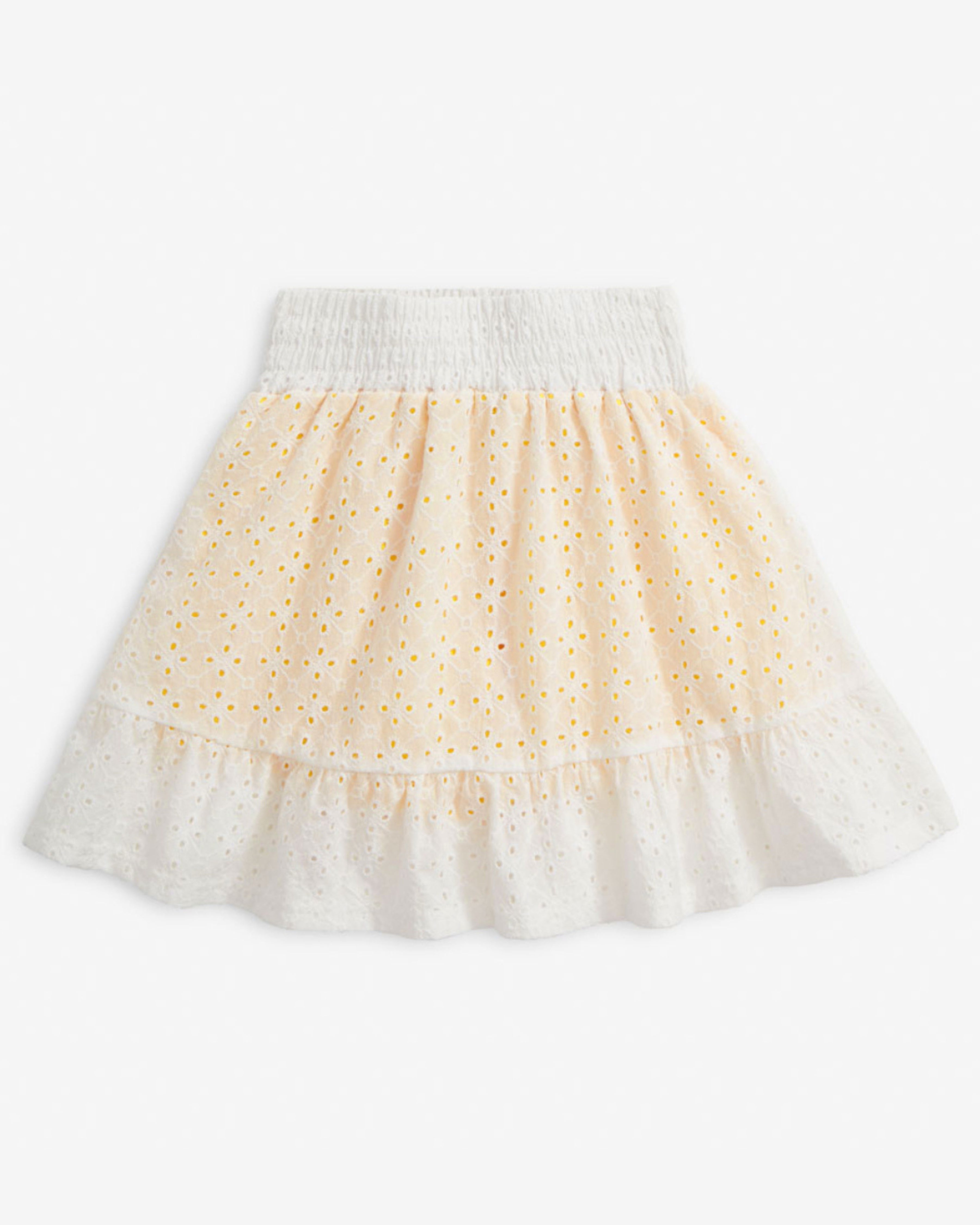Daffodil Smocked Waist Skort featuring a comfortable smocked waistband and delicate eyelet pattern in soft yellow.
