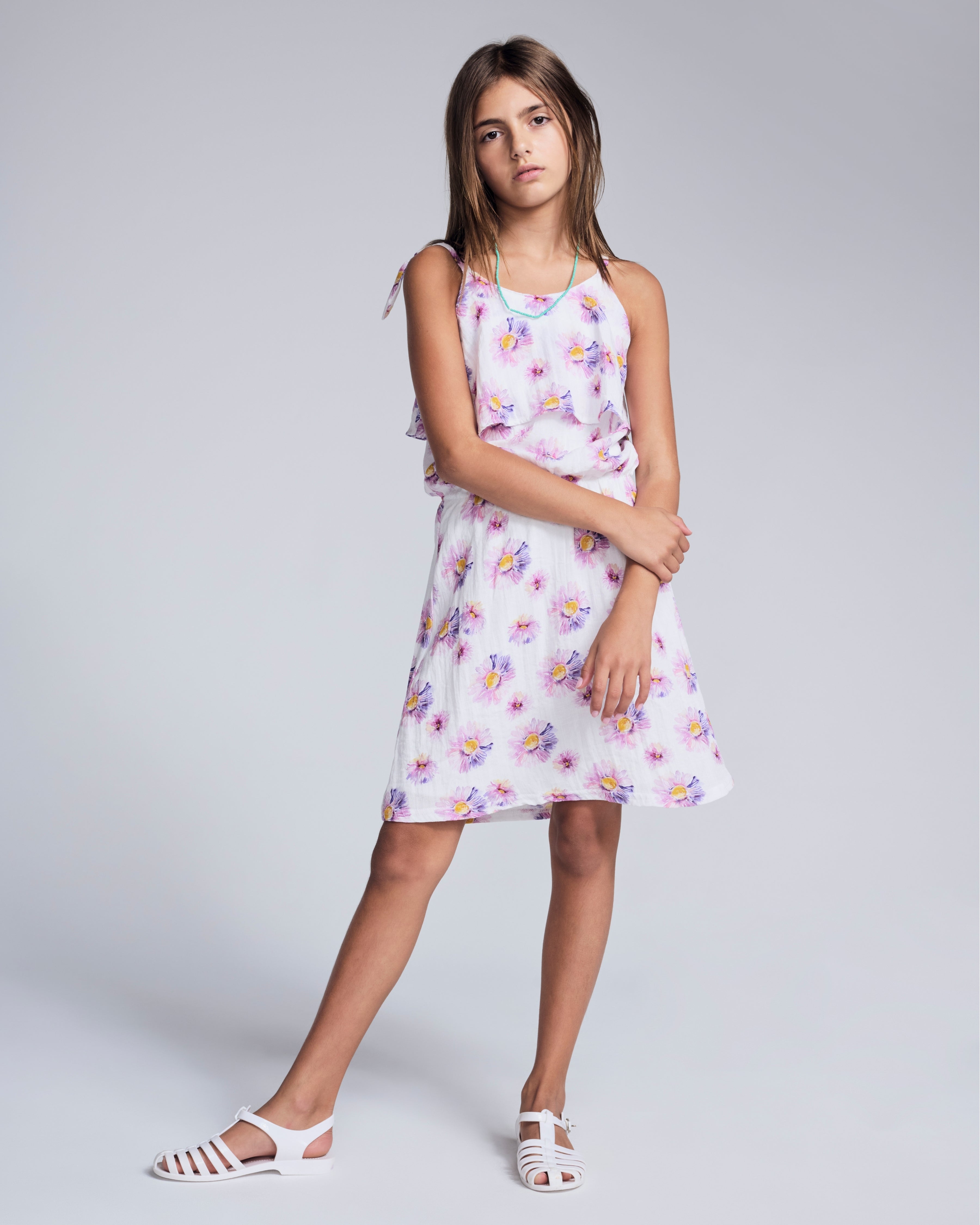 Daisies Leah Layered Dress on a girl with floral print, perfect for sunny days and spring parties.