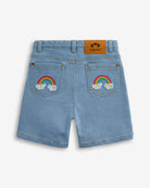 Light Wash Asymmetrical Denim Skort featuring rainbow embroidery on pockets for playful summer style.