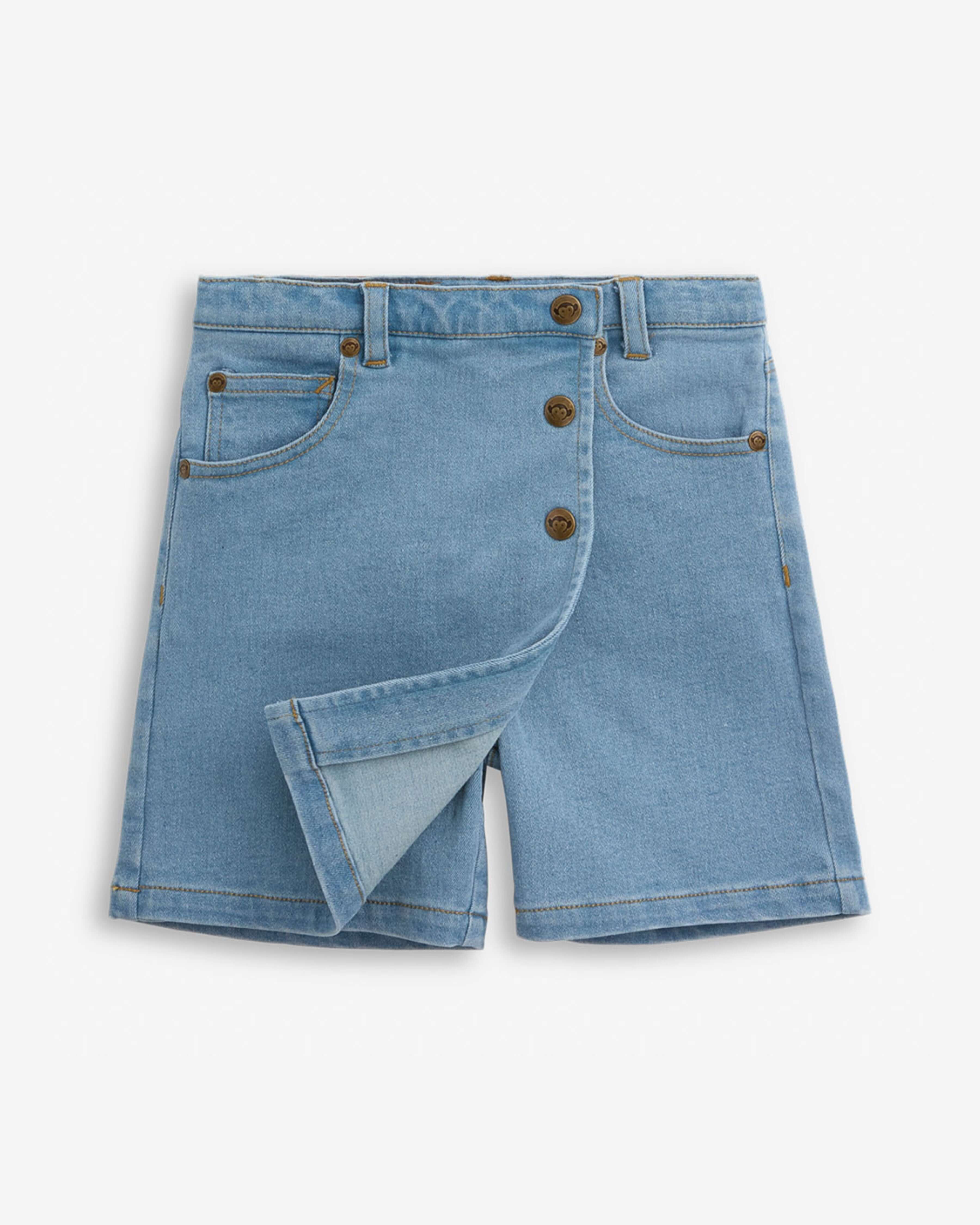 Light Wash Asymmetrical Denim Skort featuring button front closure and playful design for girls.