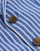 Close-up of buttons and striped fabric of the Linen Canopy Stripe Club Blazer.