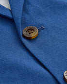 Close-up of Linen Canopy Blue Sports Jacket showcasing button and fabric details.
