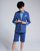 Boy wearing a Linen Canopy Blue Sports Jacket with shorts, showcasing stylish warm-weather fashion.