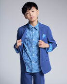 Linen Canopy Blue Sports Jacket worn by a boy showcasing a stylish look with vibrant blue shirt and pocket square.