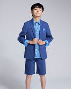 Linen Canopy Blue Sports Jacket worn by a boy, showcasing a stylish spring look with shorts and a pocket square.