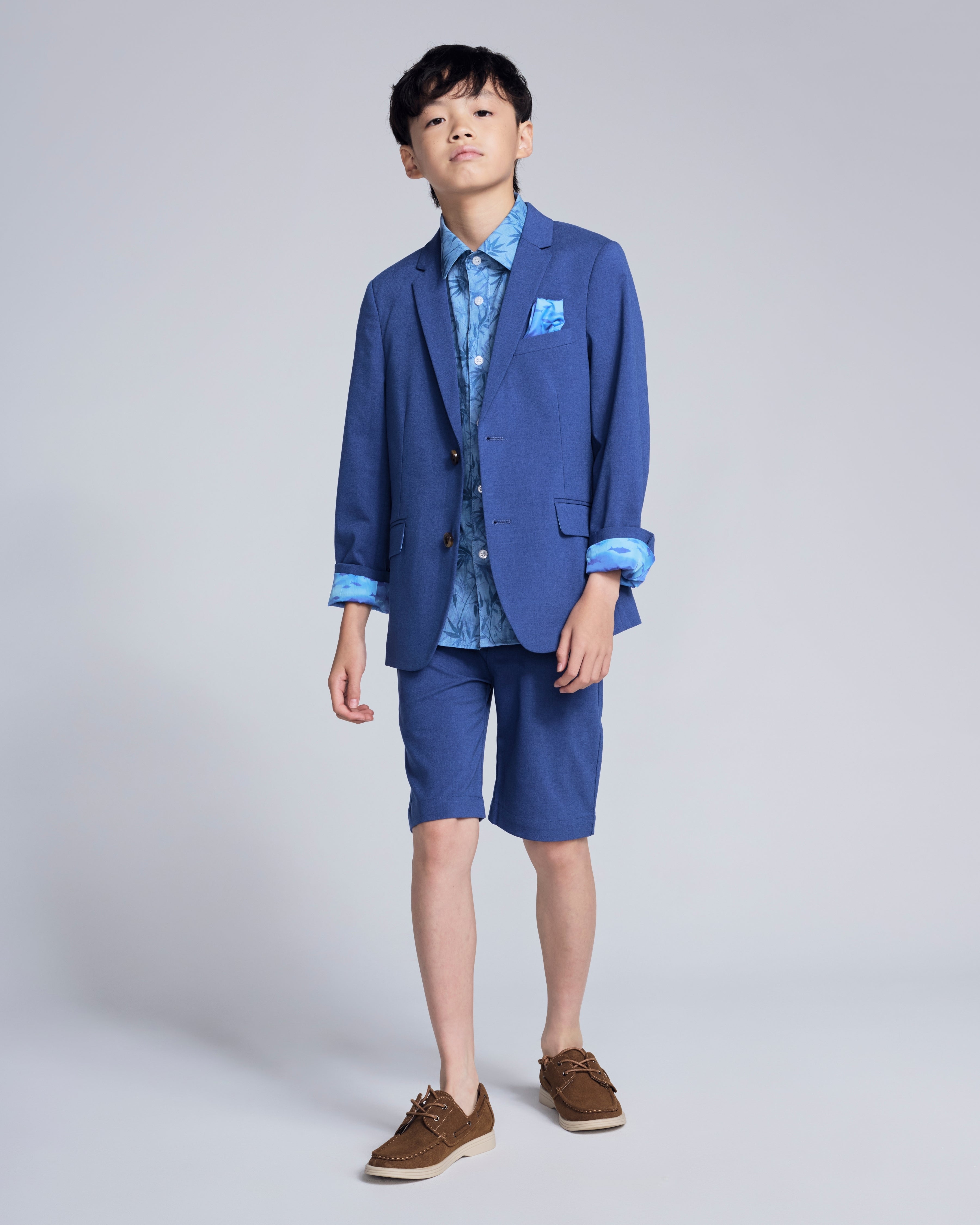 Linen Canopy Blue Sports Jacket on a boy, styled with shorts and a shirt for a polished spring look.