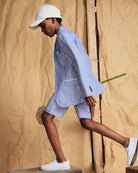 Linen Canopy Stripe Club Blazer worn by a child in a stylish spring outfit, showcasing stripes and casual elegance.
