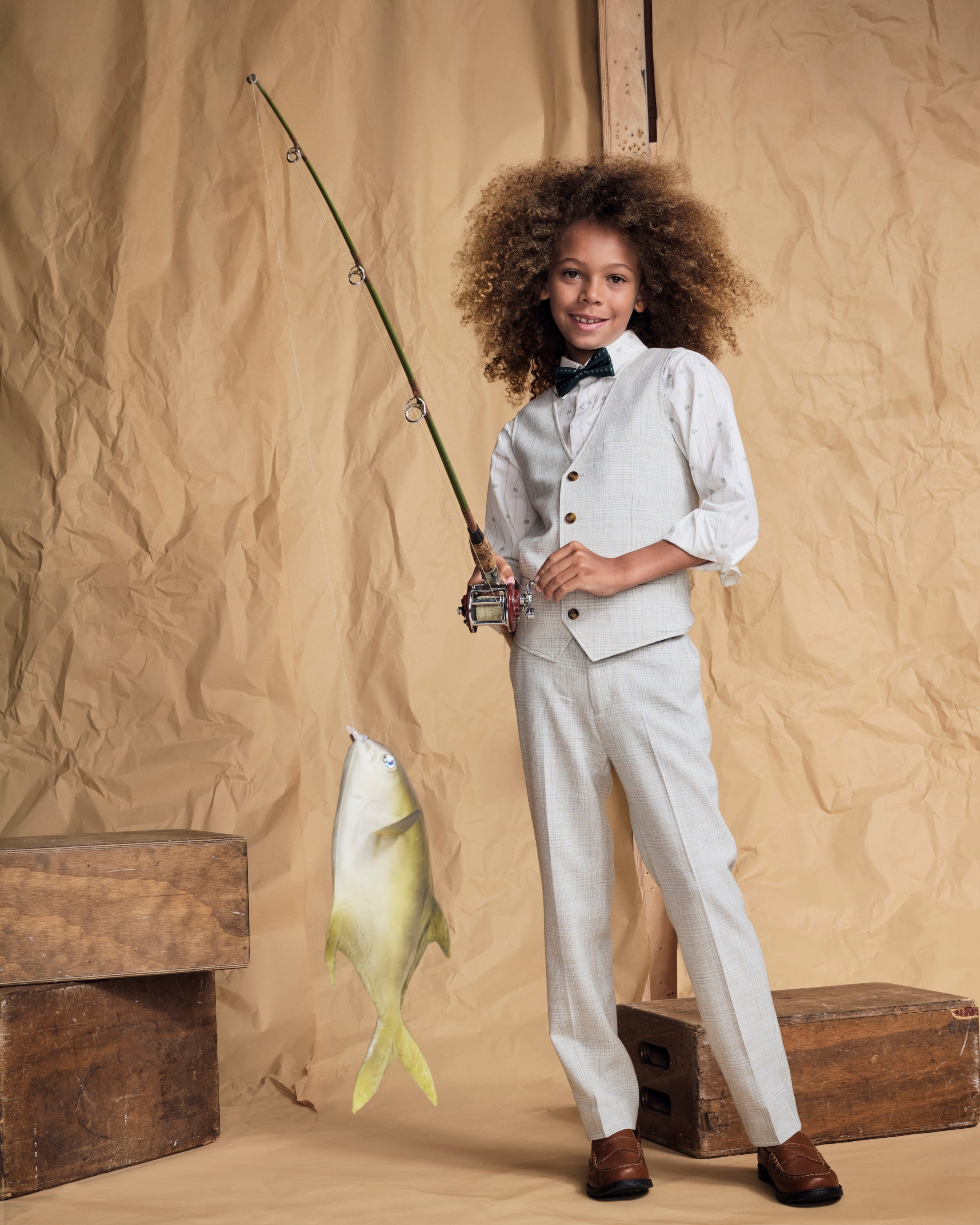Child wearing Linen Oceanside Plaid Stretchy Mod Suit Pant while fishing.