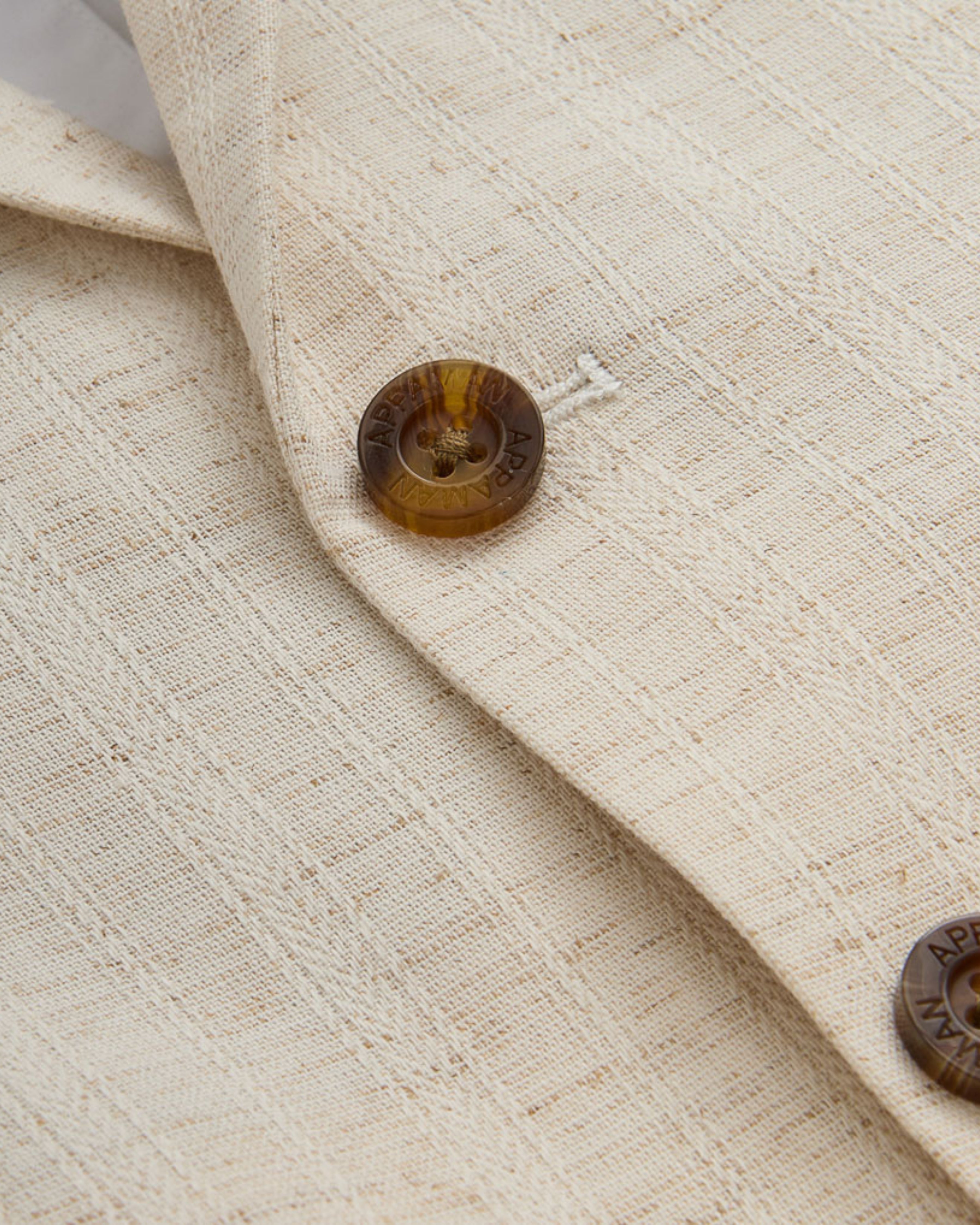 Close-up of the fabric and buttons of the Linen Ivory Sports Jacket.