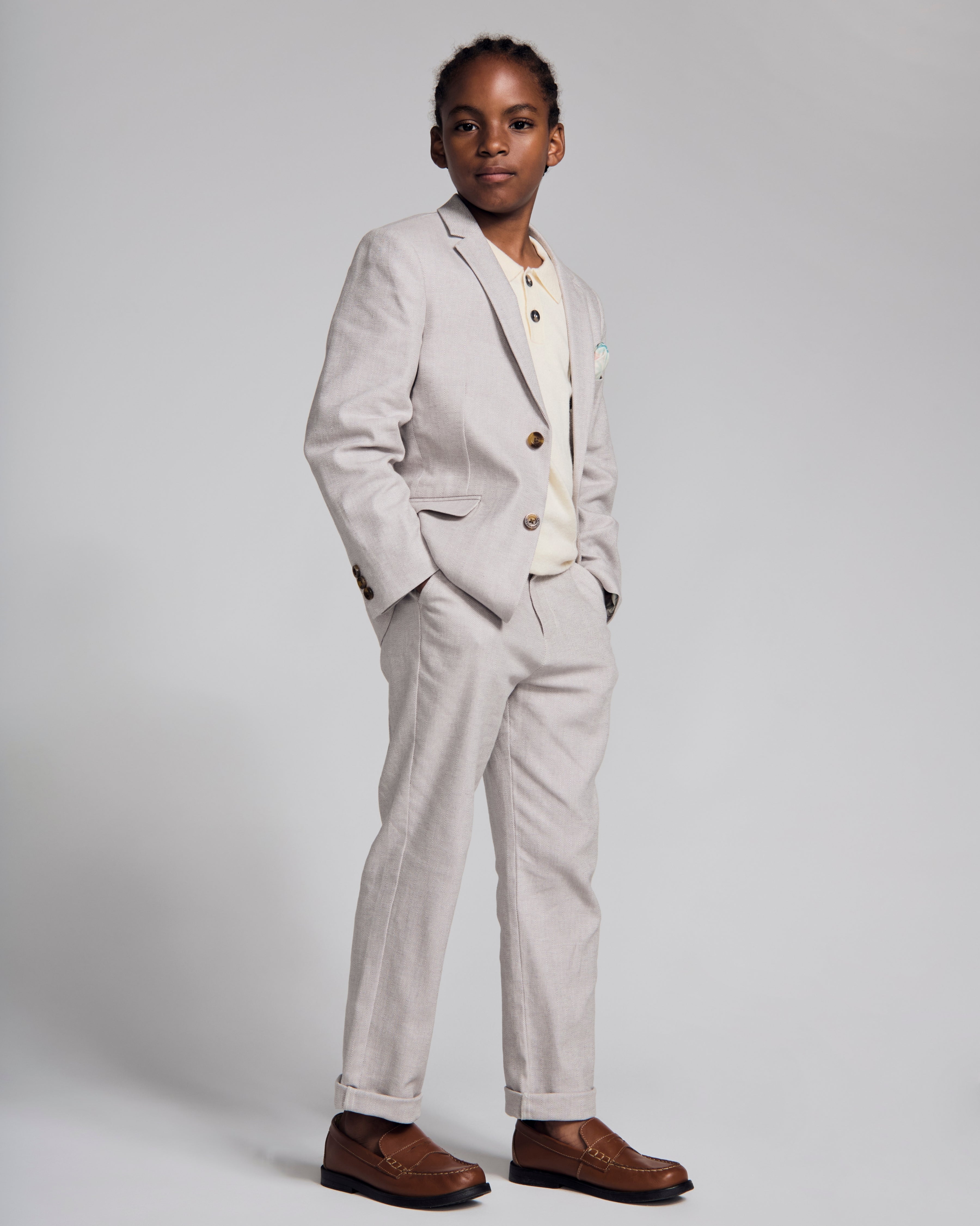 Linen Warm Grey Sports Jacket worn by a boy, showcasing timeless style and comfort in a formal setting.