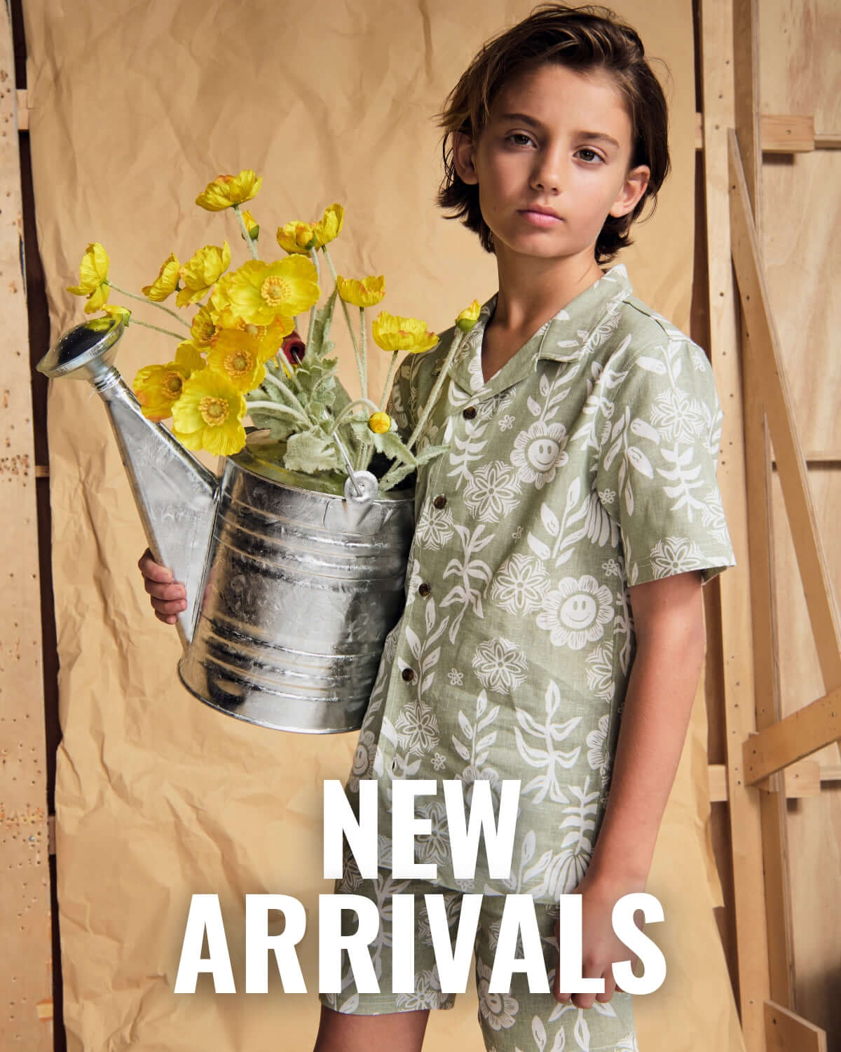 Boy wearing Green Sunflower Matching Set Holding Watering can and Flowers