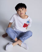 Child wearing Nautical Stripe Resort Pant with white T-shirt and popsicle design.