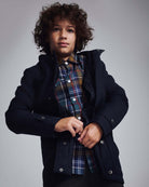 Navy Blue Urban Gotham Coat on a young boy, showcasing stylish design and premium fabric.