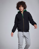 Boy wearing Novelty Grey Heather Sideline Sweatpants with a black jacket, showcasing a stylish and comfortable outfit.