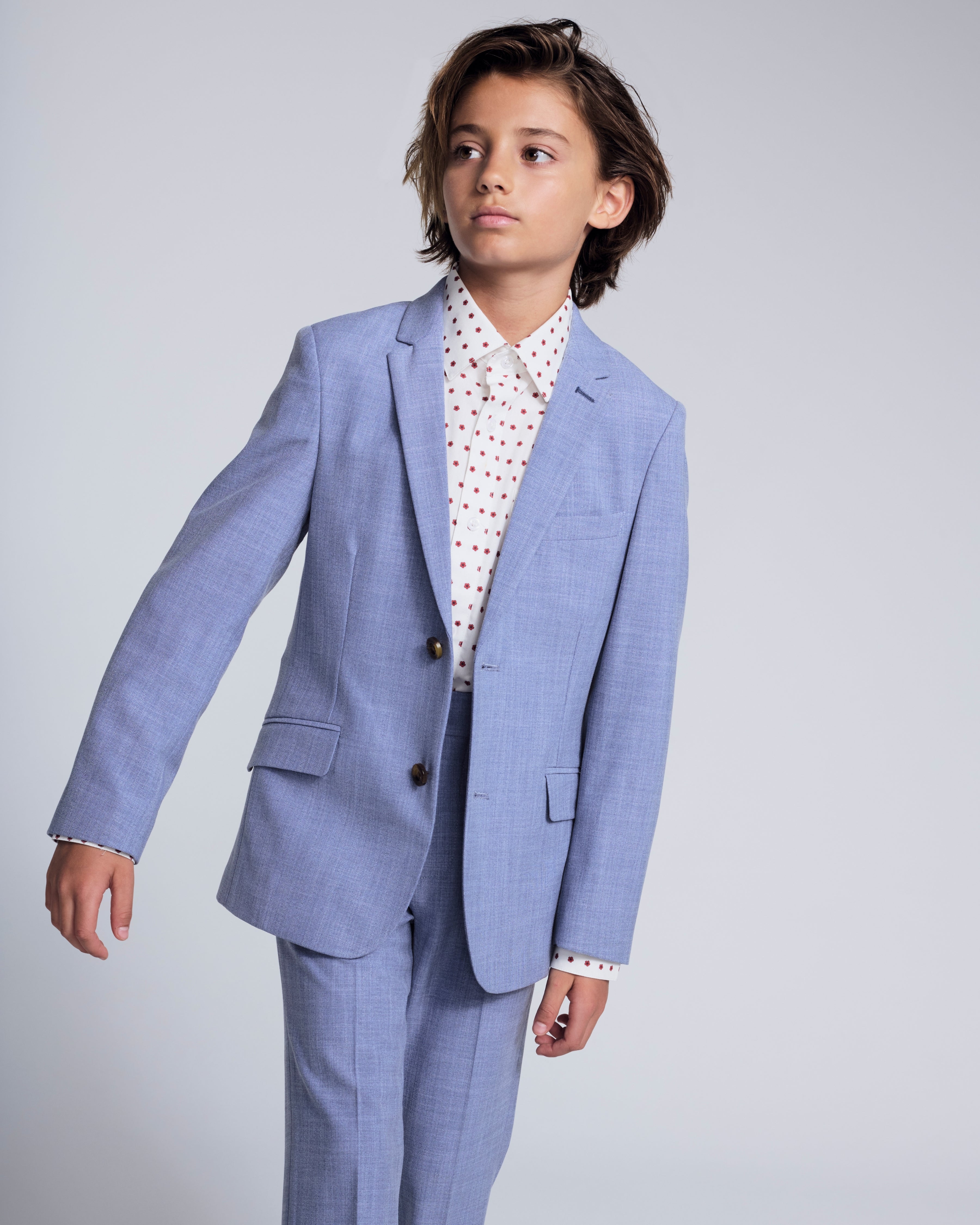 Pacific Blue Stretchy Mod Suit model wearing tailored jacket and skinny leg pants in a stylish pose.