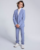 Pacific Blue Stretchy Mod Suit Pant worn by a young boy in a stylish blue suit with white sneakers.