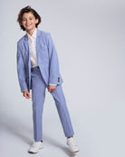 Boy modeling the Pacific Blue Stretchy Mod Suit Pant with a matching blazer and stylish sneakers.