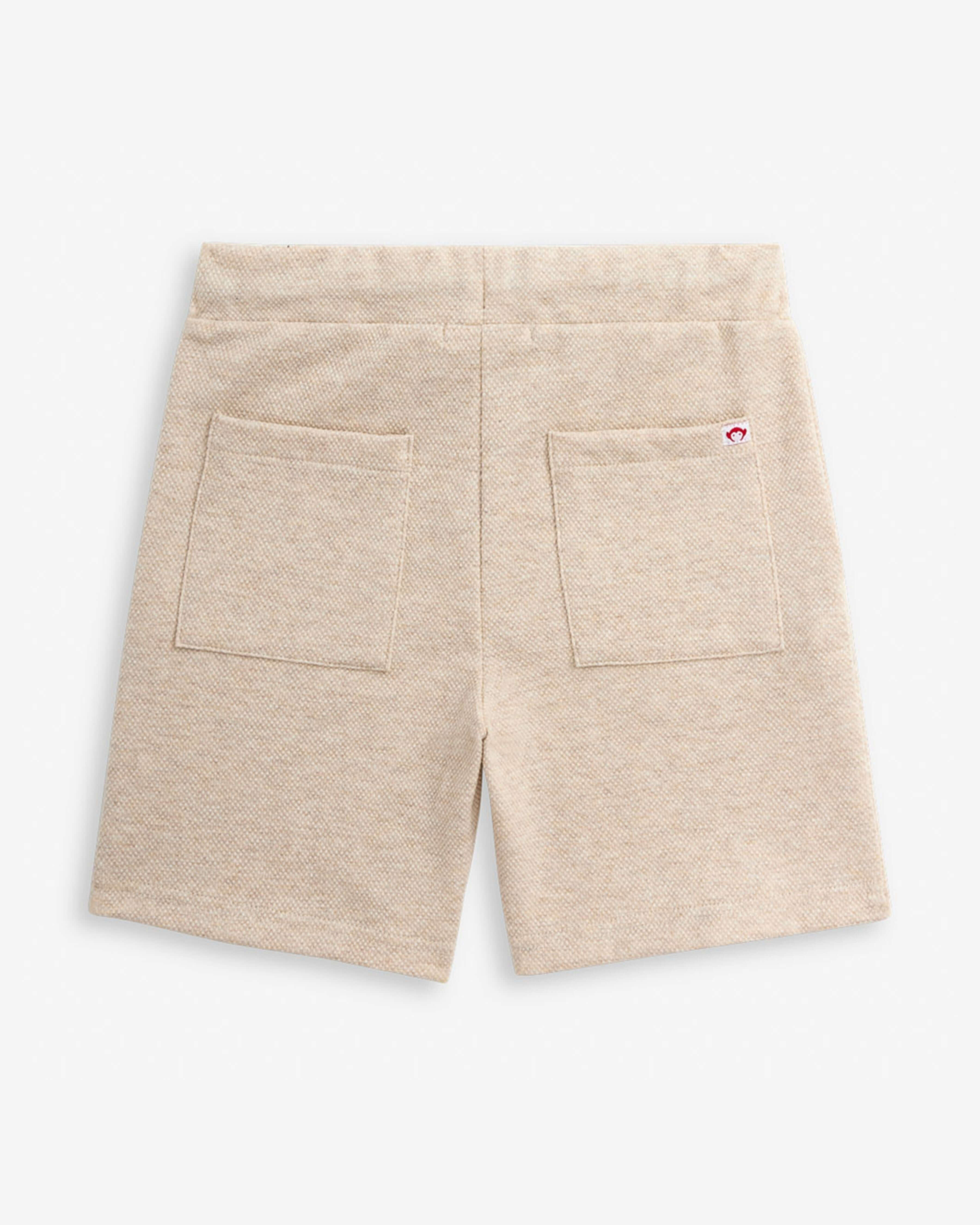 Back view of Sandshell Resort Short showcasing two functional pockets and a comfortable elastic waistband.