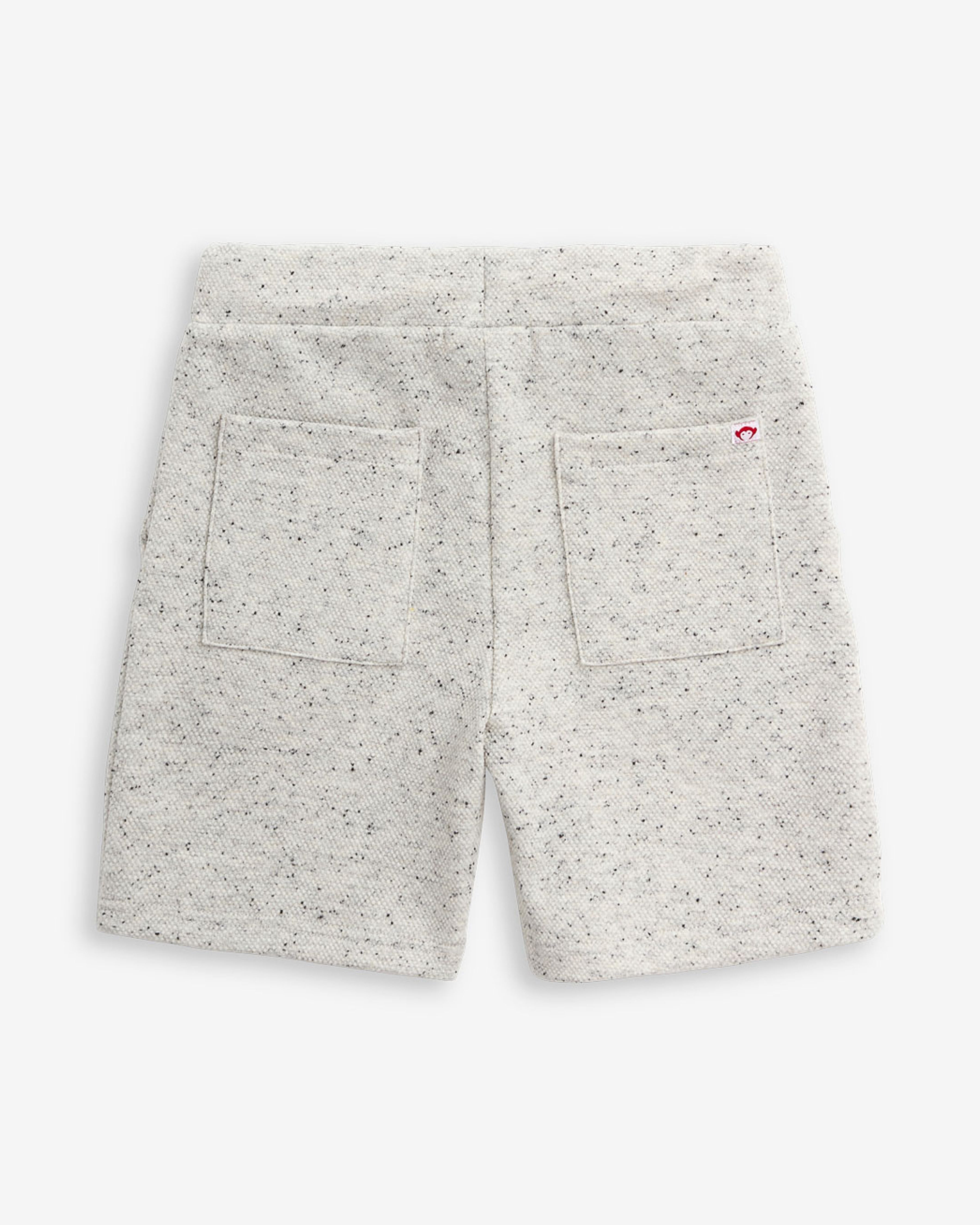 Back view of Speckled Natural Resort Short with two pockets, designed for comfort and style during summer days.