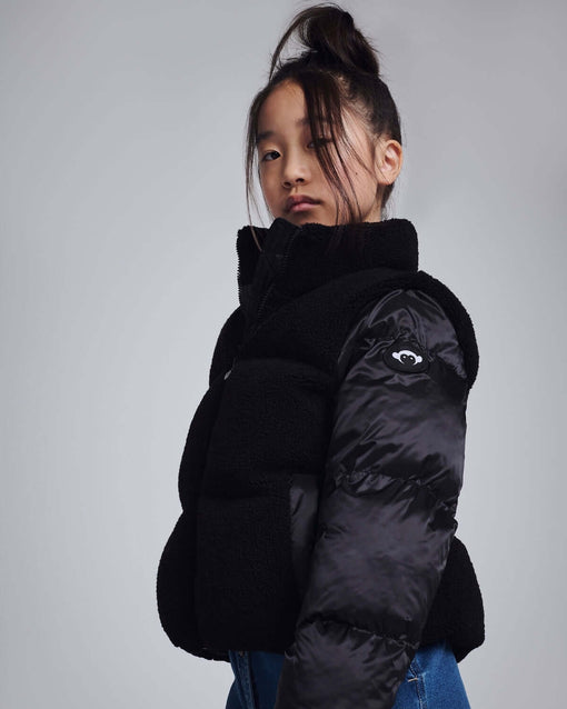 a girl in a black coat