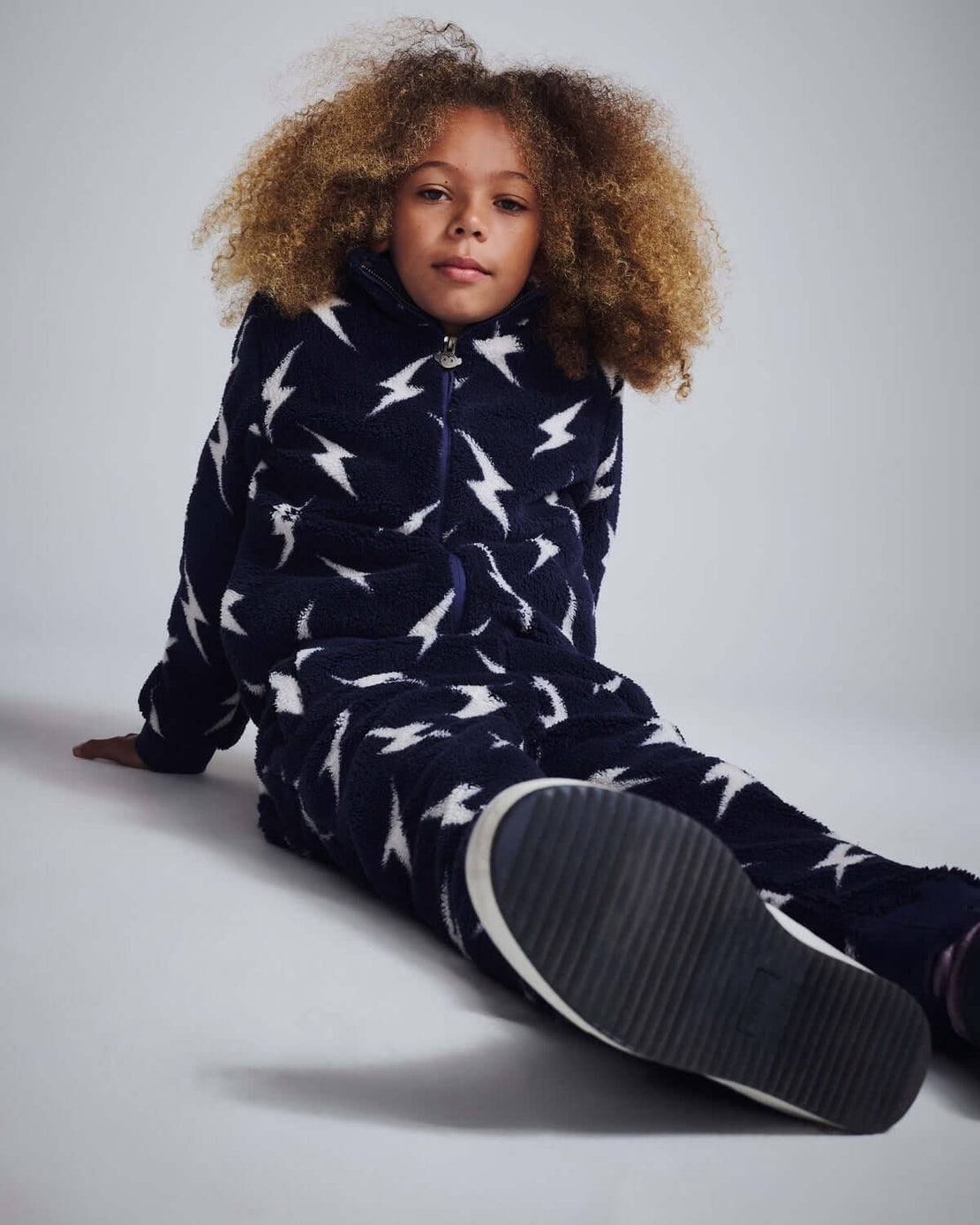 a girl in a blue pajamas