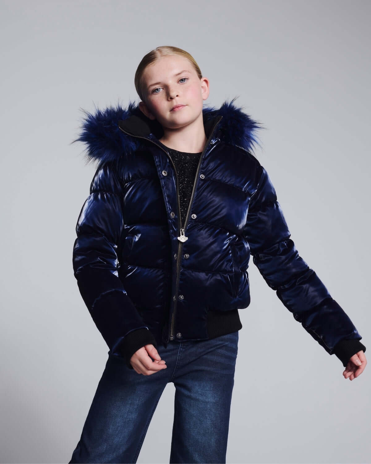 a girl in a blue jacket